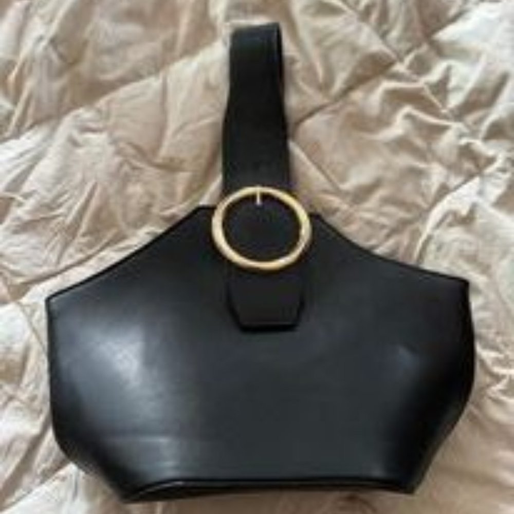 Sleek black vinyl bag.